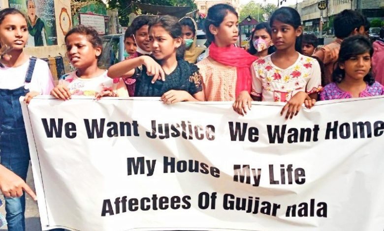 Victims of the operation against encroachments on Gujjar Nala protest in front of Bilawal House