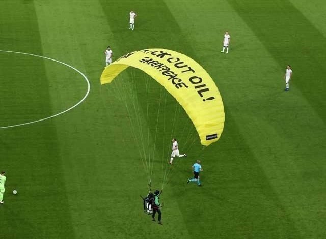 Parachute jumps into stadium during Euro match