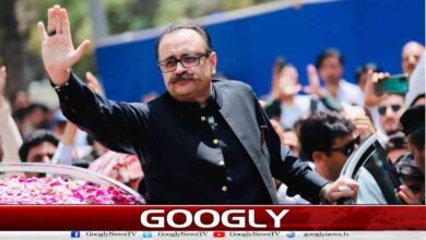 Former Azad Kashmir Prime Minister Tanveer Ilyas's convoy fired upon; one guard killed.