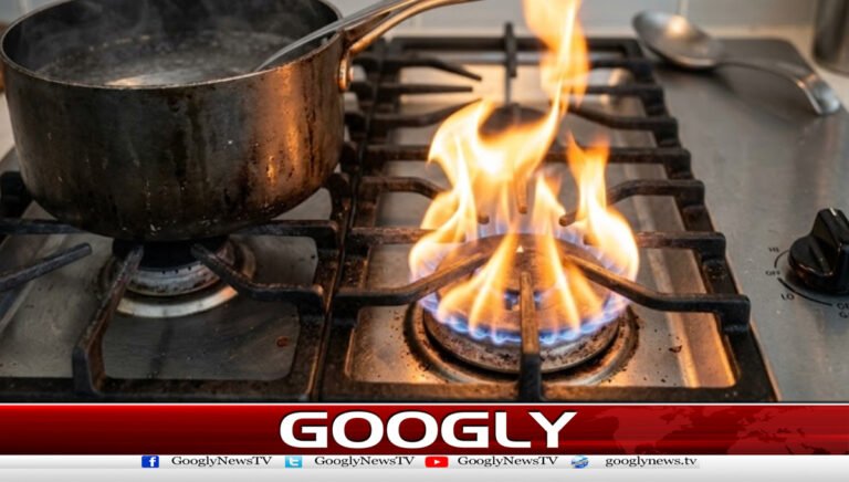 Why does an orange flame appear in a gas stove?